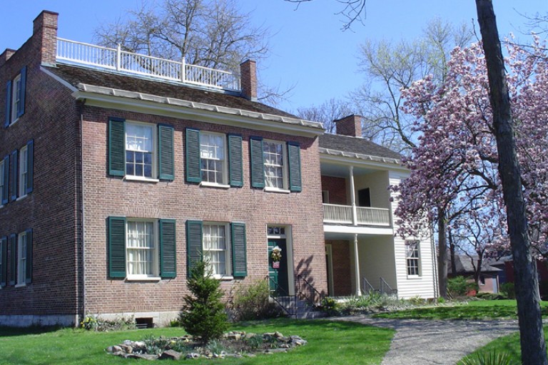 Color photograph of the exterior of the Wylie House Museum in the daytime.